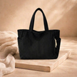 Large FJØRNA corduroy tote bag for women, showing a spacious, textured bag with sturdy handles and stylish design.