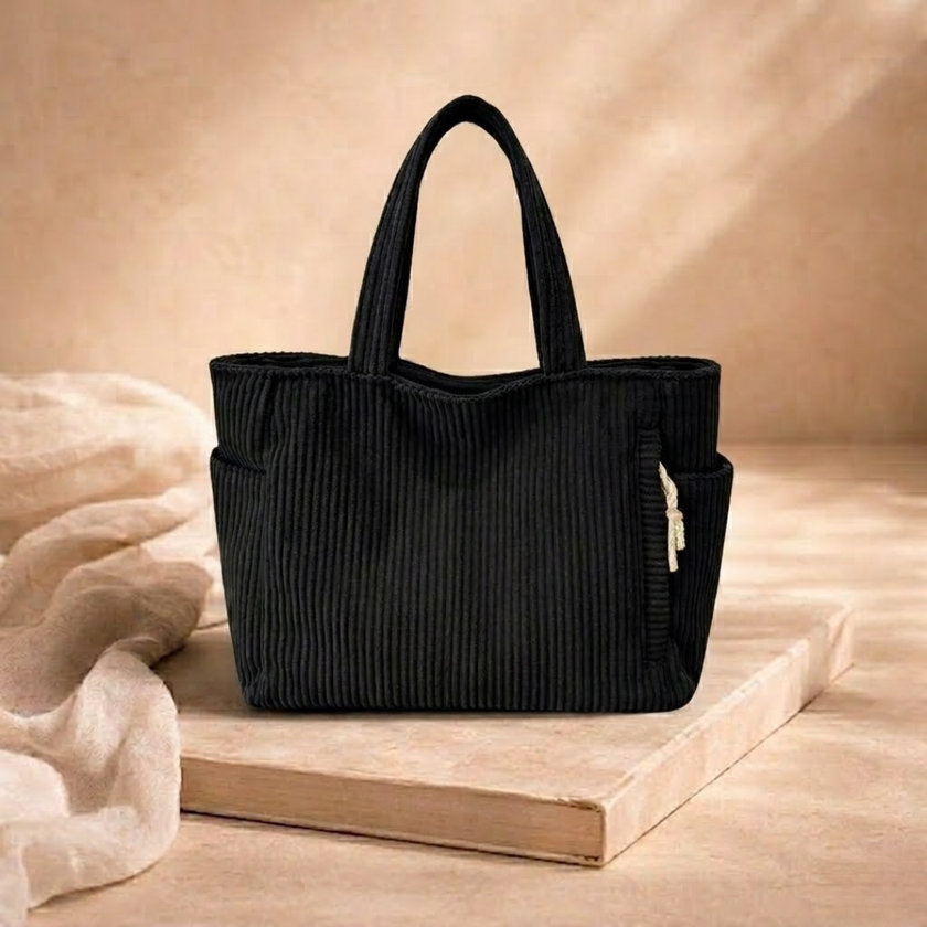 Large FJØRNA corduroy tote bag for women, showing a spacious, textured bag with sturdy handles and stylish design.