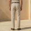 FJØRNA men's linen blend straight leg trousers with pleats and relaxed fit, showing the lightweight fabric and tailored design.