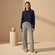 FJØRNA women's drawstring striped trousers with relaxed fit and casual style, featuring vertical stripes and comfortable fabric.