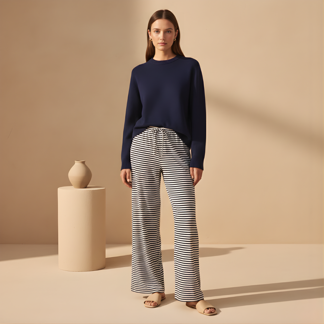 FJØRNA women's drawstring striped trousers with relaxed fit and casual style, featuring vertical stripes and comfortable fabric.