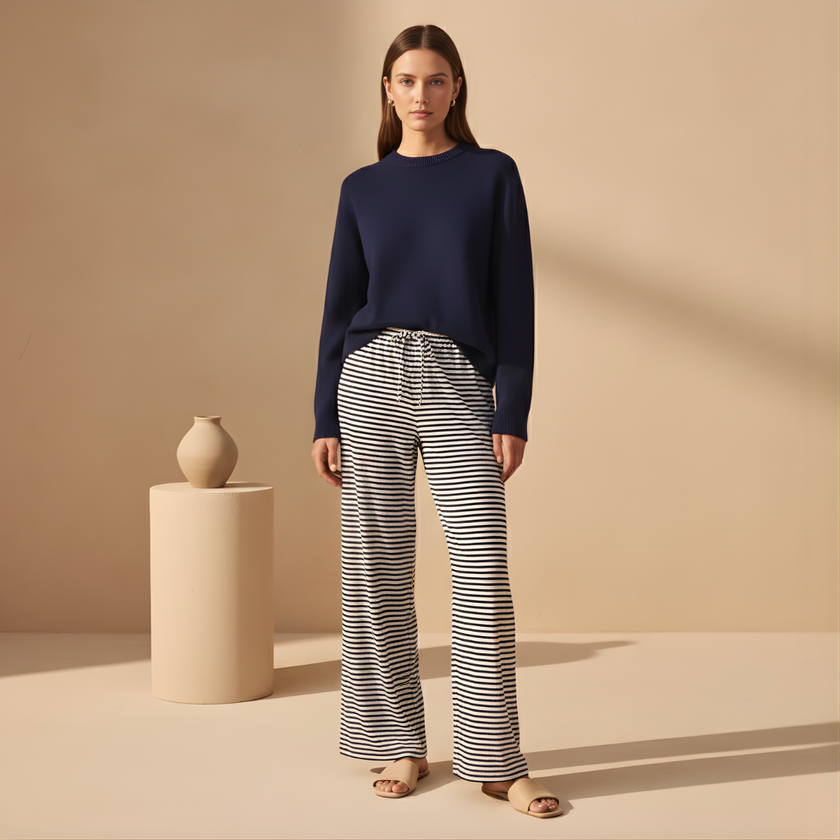 FJØRNA women's drawstring striped trousers with relaxed fit and casual style, featuring vertical stripes and comfortable fabric.