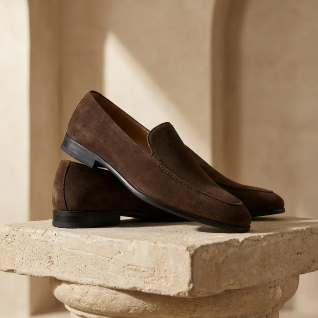 FJØRNA men's suede shoes displayed on a plain background, showcasing their stylish design and soft texture.