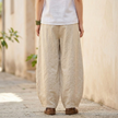 FJØRNA women's cotton linen trousers with high waist and relaxed fit, featuring a stylish, lightweight pant design.