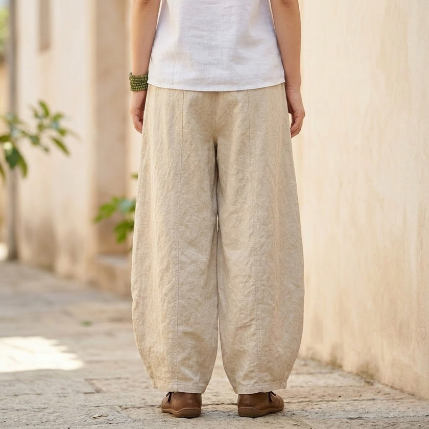 FJØRNA women's cotton linen trousers with high waist and relaxed fit, featuring a stylish, lightweight pant design.