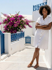 FJØRNA women's summer dress with short sleeves, pockets, and a flowy design, perfect for warm weather.