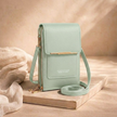 FJØRNA women's anti-theft travel crossbody bag with secure zipper and adjustable strap, designed for convenient travel and everyday use.