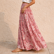 FJØRNA women's high waist maxi skirt with paisley print, flowing design, and full-length silhouette.