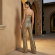 FJØRNA women's sequin flared jumpsuit with pants, featuring shiny sequins and a stylish, fitted design.