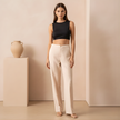 Women’s straight leg trousers by FJØRNA, tailored pants in neutral fabric, displayed flat on a white background.