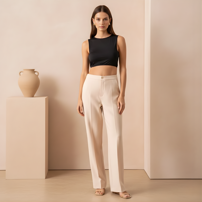 Women’s straight leg trousers by FJØRNA, tailored pants in neutral fabric, displayed flat on a white background.