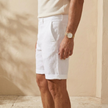 Men's linen blend shorts by FJØRNA featuring a tailored, relaxed fit and casual style, suitable for warm weather.