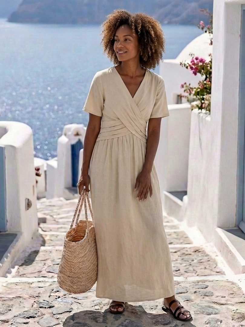 FJØRNA women's summer midi dress with V-neck, short sleeves, wrap style, flowy fabric, perfect for warm weather.