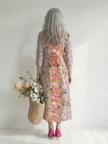 FJØRNA floral summer midi dress for women with long sleeves, wrap style, flowy fabric, perfect for warm weather.