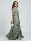 FJØRNA elegant floral maxi dress for women with halter neck, flowing design, perfect for summer or special occasions.