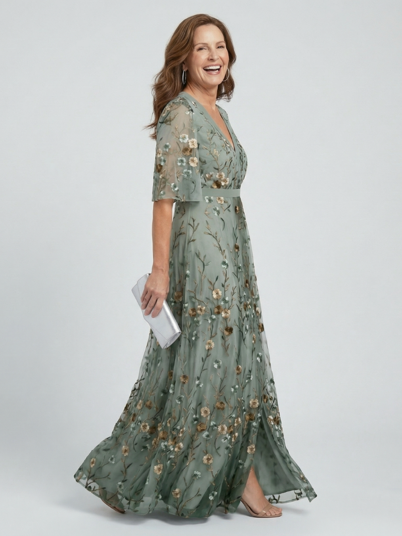 FJØRNA elegant floral maxi dress for women with halter neck, flowing design, perfect for summer or special occasions.