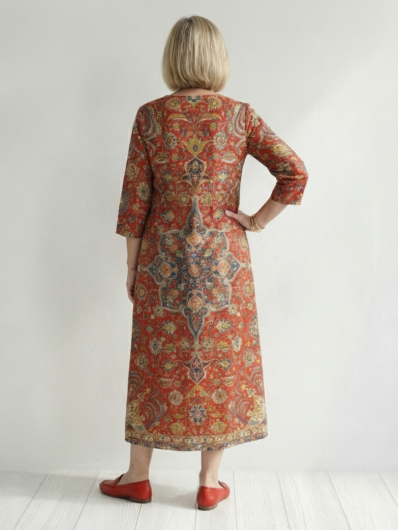 FJØRNA women's summer midi dress with long sleeves, wrap style, flowy tail, and tailored fit, perfect for warm weather.