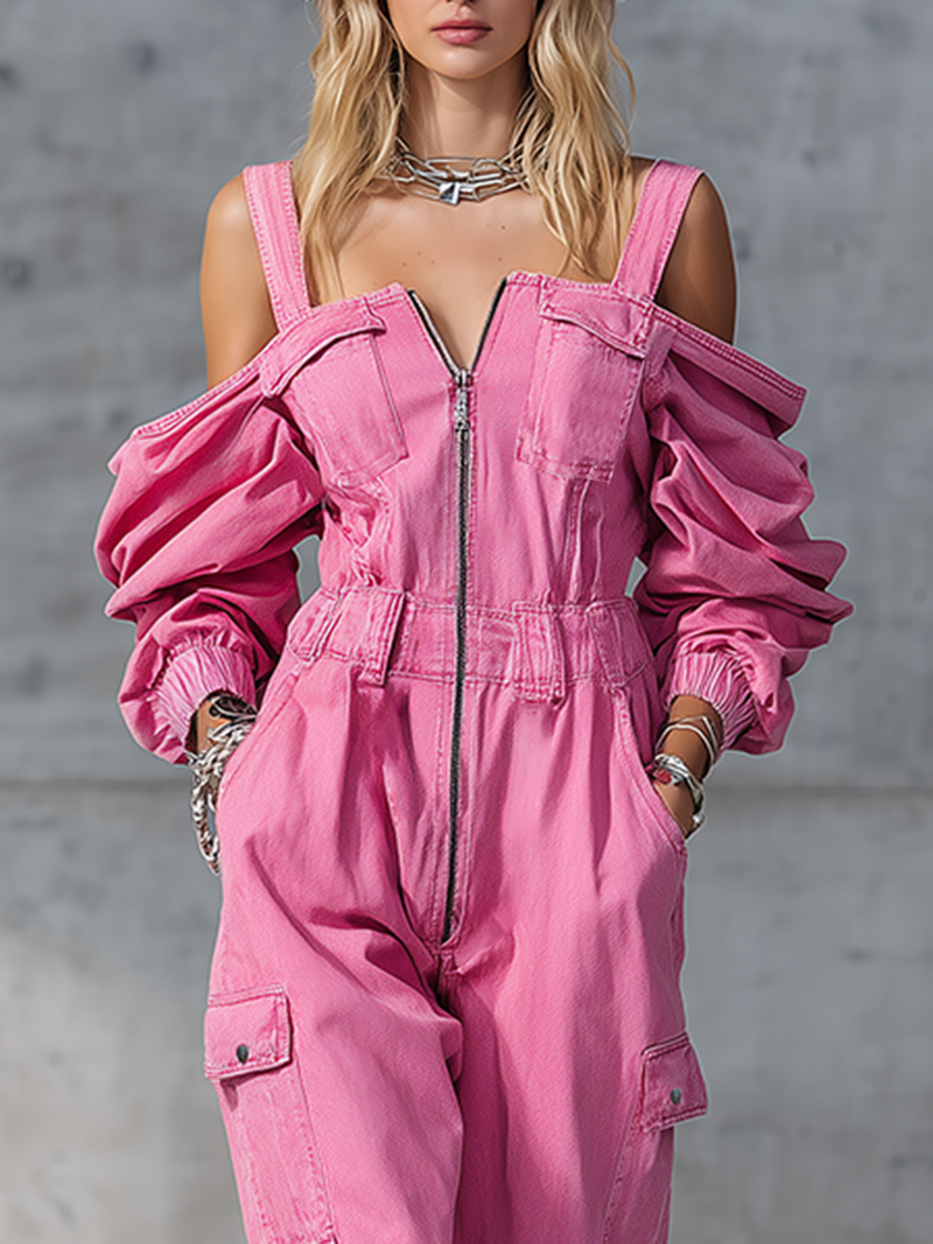 Pink denim strappy tapered long sleeve jumpsuit by FJØRNA, featuring a fitted design with adjustable straps and long sleeves.
