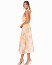 FJØRNA elegant maxi dress for women with a printed halter neck, flowing fabric and stylish design perfect for summer wear.