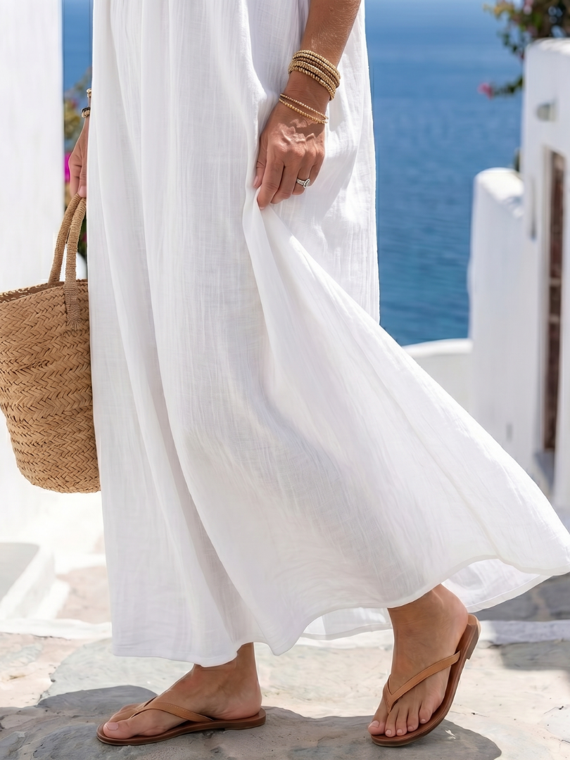 FJØRNA women's sleeveless summer maxi dress with a wrap design, flowy and lightweight for warm weather wear.
