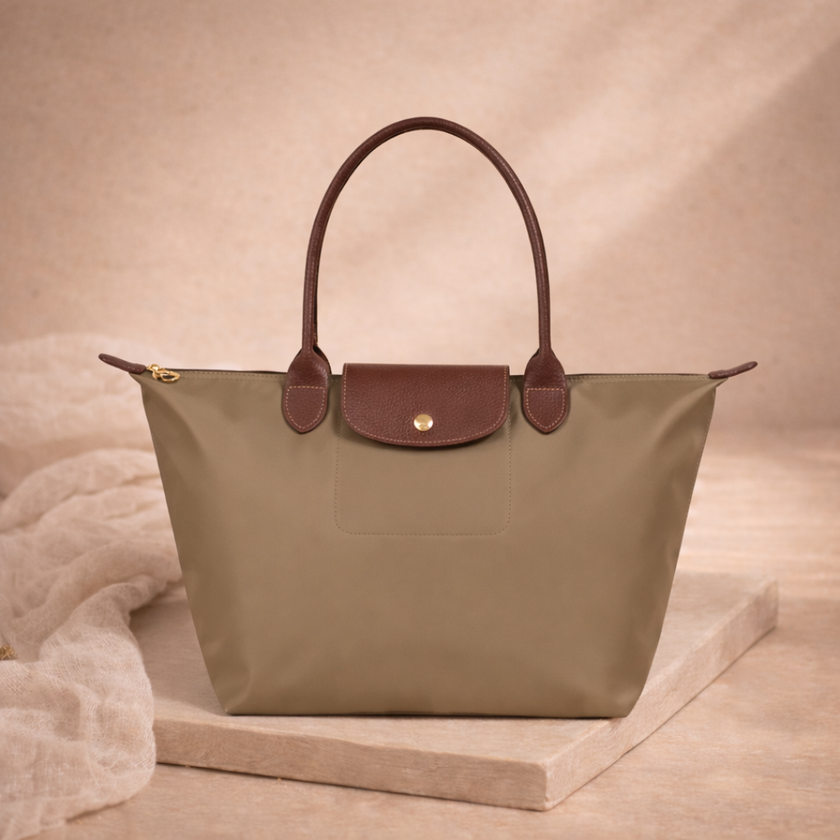 FJØRNA leather tote bag for women, large foldable bag with sleek design, showcasing sturdy leather material and spacious interior.