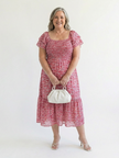 FJØRNA women's floral summer midi dress with puff sleeves and wrap style, perfect for warm-weather occasions.
