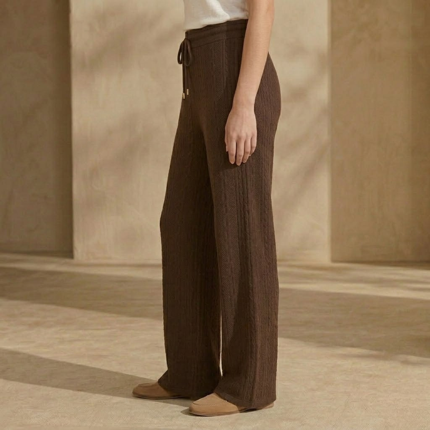 FJØRNA women's knit lounge trousers with cable knit pattern, cozy and stylish pants for comfortable wear.