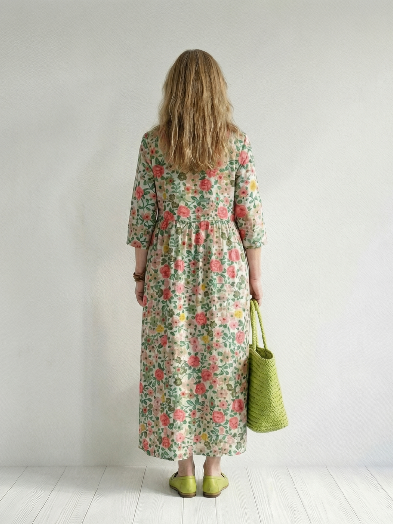 FJØRNA women's floral summer midi dress with long sleeves, wrap style, relaxed fit, perfect for warm weather.