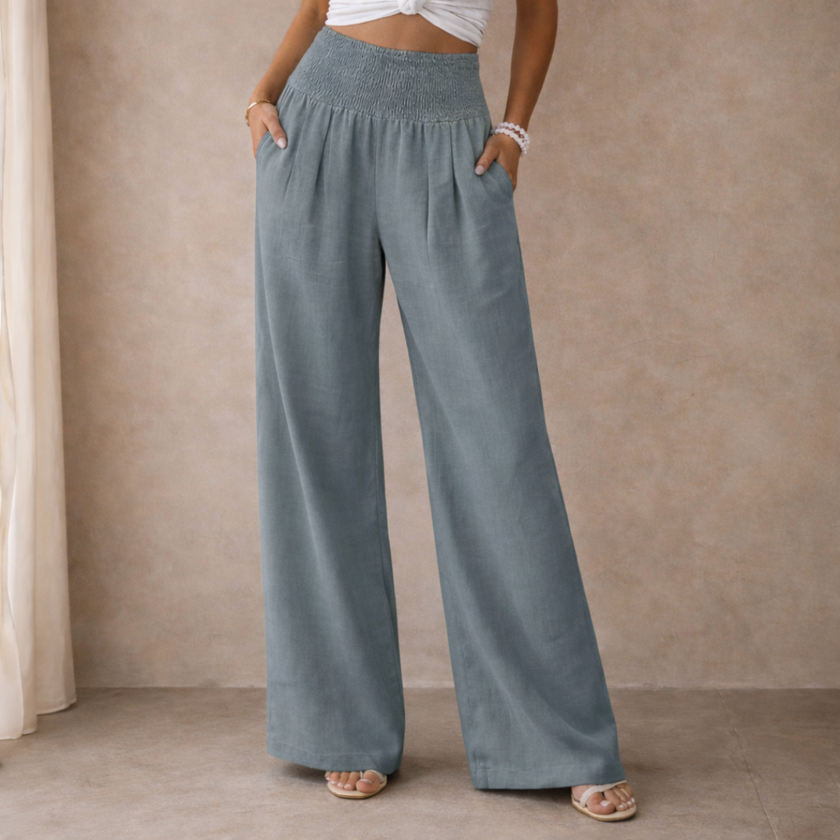 FJØRNA linen blend wide-leg women's trousers with elastic waist, relaxed fit and flowing fabric, suitable for casual wear.
