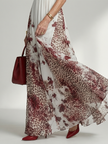 FJØRNA women's floral summer maxi dress with V-neck and long sleeves, lightweight and flowy for warm weather wear.