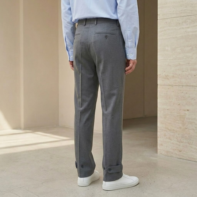 Men's tailored relaxed fit straight leg trousers by FJØRNA, shown in a neutral color with a classic waistband and front pockets.
