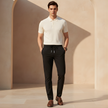 Men's FJØRNA trousers, stylish and comfortable pants with a tailored fit, shown in a neutral color on a plain background.