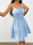 White FJØRNA sleeveless tiered sundress with drawstring detail, featuring a flowy, layered design perfect for warm weather.