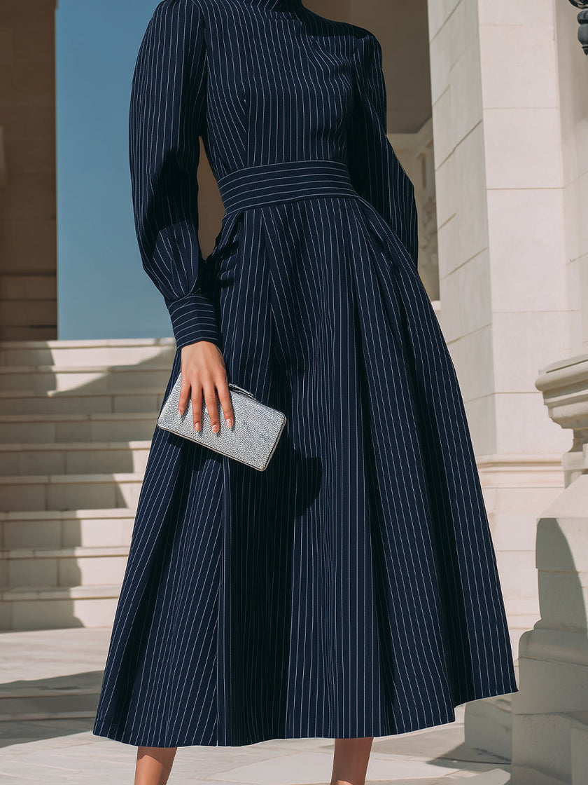 FJØRNA high-neck pinstripe midi dress for women featuring a structured waist and elegant design, perfect for formal occasions.