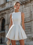 FJØRNA sleeveless structured pleated mini dress with a fitted bodice and flared skirt, perfect for stylish summer wear.