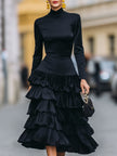 FJØRNA elegant mock neck tiered ruffle midi dress for women, showcasing a flowing design with layered ruffles and a fitted bodice.