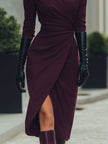 Deep burgundy FJØRNA draped wrap midi dress showing flowing fabric and elegant draping detail.