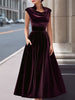 FJØRNA velvet cowl-neck sleeveless evening gown with an A-line silhouette and long sleeves, suitable for formal occasions.