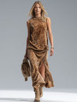 FJØRNA leopard print sleeveless vest and velvet split-hem skirt set, stylish fashion ensemble with bold animal pattern and luxurious textures.