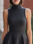 FJØRNA charcoal sleeveless turtleneck flared mini dress, grey wedding guest dress, stylish and elegant for special occasions.