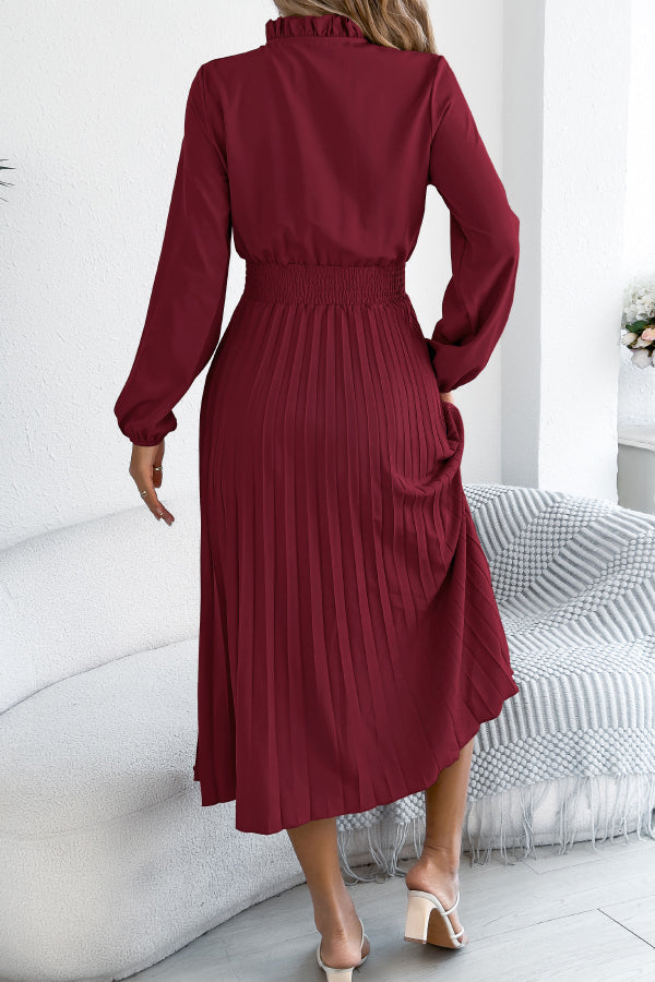 FJØRNA solid color long-sleeved fitted waist pleated midi dress shown on a model, elegant and stylish for formal occasions.