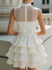 FJØRNA high-neck sheer yoke tiered ruffle mini dress, featuring a delicate layered design and elegant silhouette.