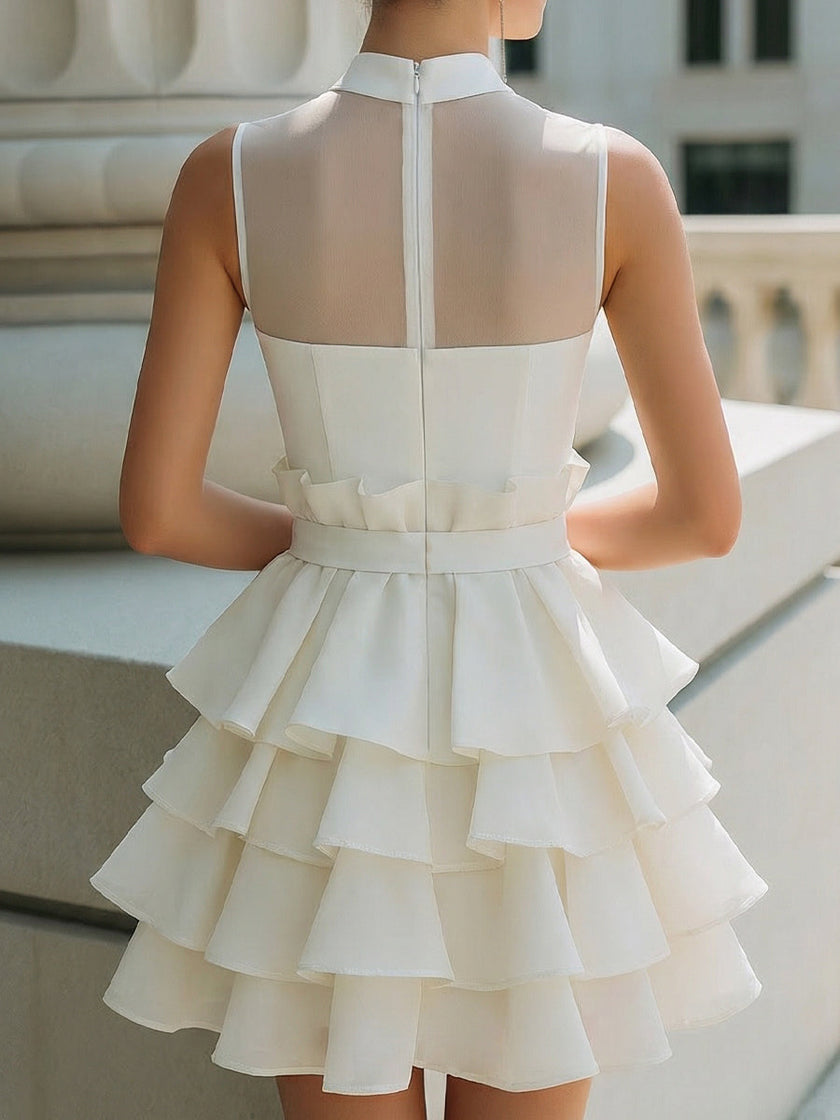 FJØRNA high-neck sheer yoke tiered ruffle mini dress, featuring a delicate layered design and elegant silhouette.