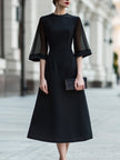FJØRNA sheer sleeve midi dress with structured waist, elegant design, lightweight fabric, and fitted silhouette.