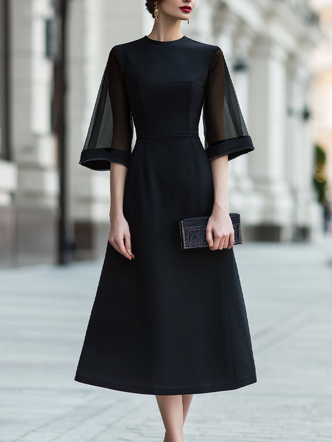 FJØRNA sheer sleeve midi dress with structured waist, elegant design, lightweight fabric, and fitted silhouette.