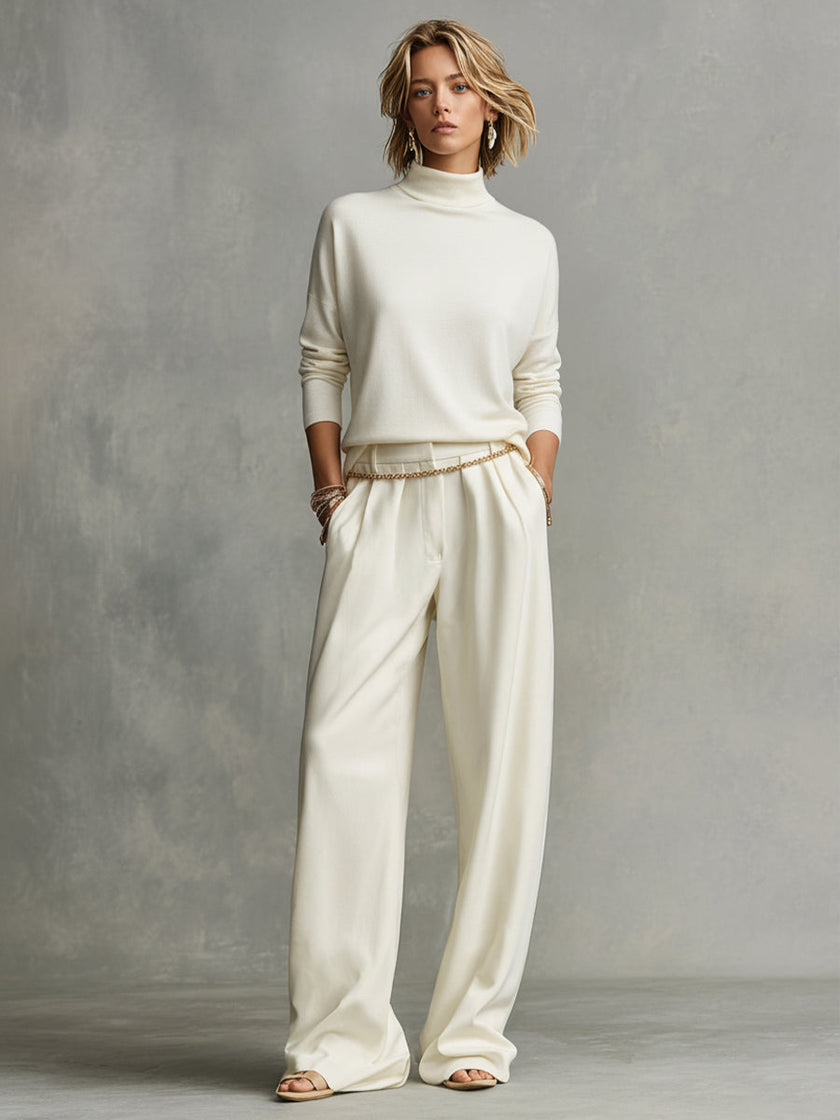 FJØRNA women's lightweight summer trousers with wide legs and belt, showcasing relaxed fit and breathable fabric for warm weather.