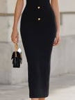 FJØRNA black halter neck cutout midi bodycon dress with fitted silhouette and stylish design, shown on a model.