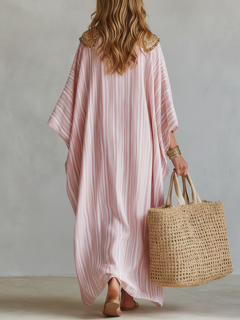 FJØRNA bohemian soft pink striped maxi kaftan dress, flowing lightweight dress with relaxed fit and vibrant pink and white stripes.