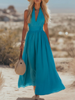 FJØRNA women's bohemian sleeveless cotton maxi dress with elegant resort style, vibrant patterns and flowing silhouette.