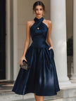 FJØRNA cross-halter pleated midi dress for women, showcasing a flowy, elegant design with pleats and a stylish halter neckline.